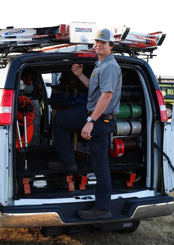 A Buzz Electrical technician with a fully stocked service van